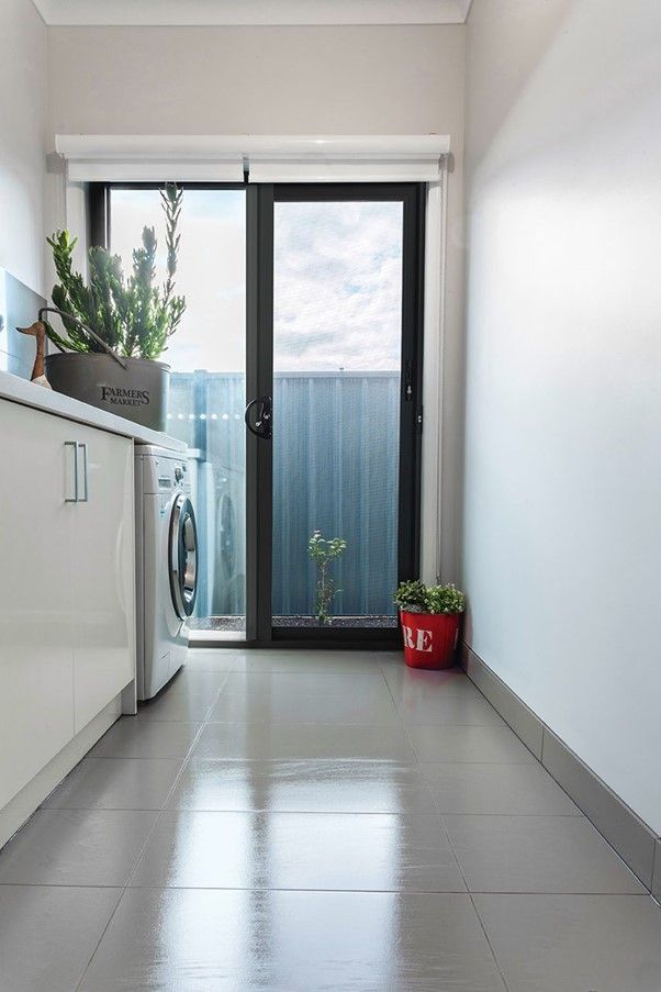 Modern Screen Door with Sleek Design and Mesh Security Screen A sleek screen door with a minimalist design and a durable mesh security screen for home safety.